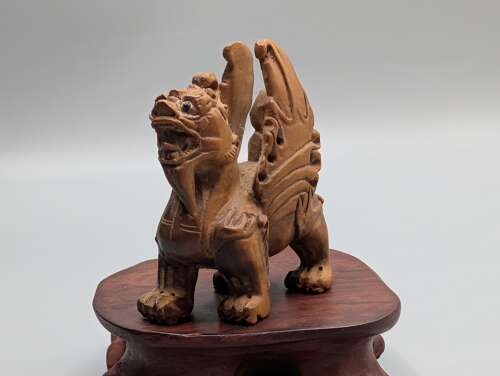 Japanese boxwood carved netsuke group of three, kirin, teapot & foot with hardwood stand