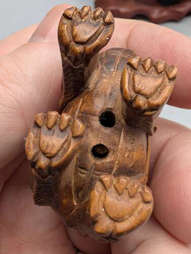 Japanese boxwood carved netsuke group of three, kirin, teapot & foot with hardwood stand