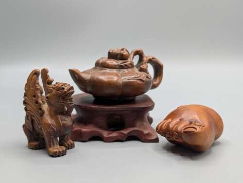 Japanese boxwood carved netsuke group of three, kirin, teapot & foot with hardwood stand