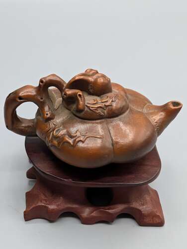 Japanese boxwood carved netsuke group of three, kirin, teapot & foot with hardwood stand