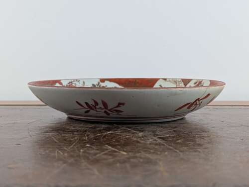 Japanese Kutani porcelain plate with aka-e bird and flowers, early Meiji