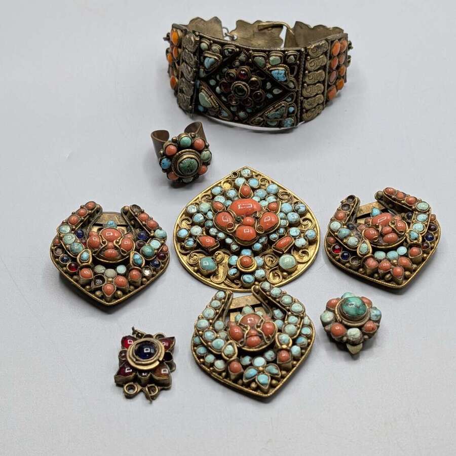 Vintage Nepalese gilt metal jewellery group with turquoise and coral
