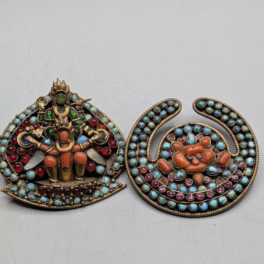 Pair of Tibetan Nepalese crescent brooches with turquoise coral and glass, 20th century