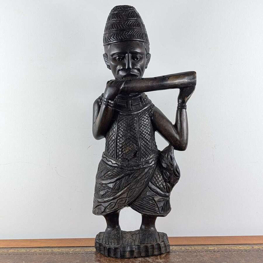 Large African hardwood carved Benin hornblower figure, mid to late 20th century