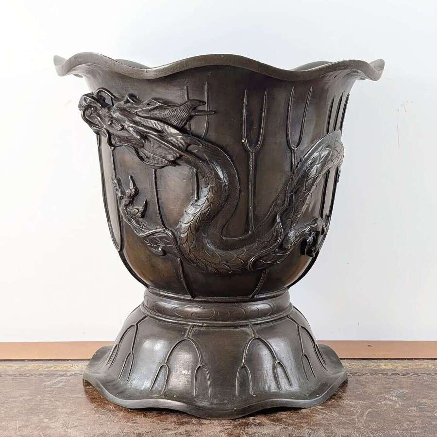 Japanese bronze dragon jardiniere in lotus form, Meiji period, late 19th century