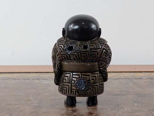 Japanese lacquered wood netsuke of a laughing boy with kettle